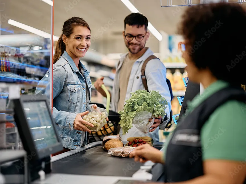 People at the grocery story checking out 