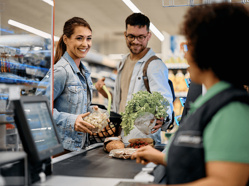 People at the grocery story checking out 